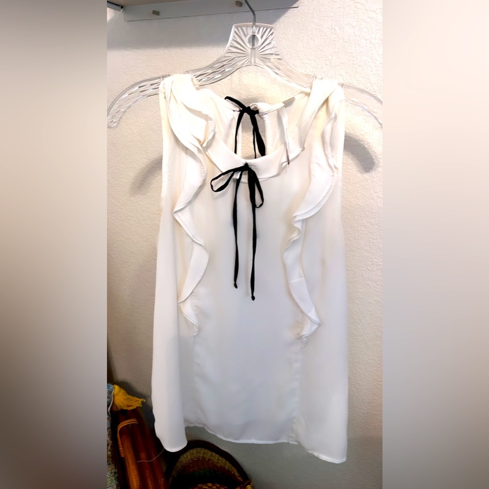 White sleeveless blouse